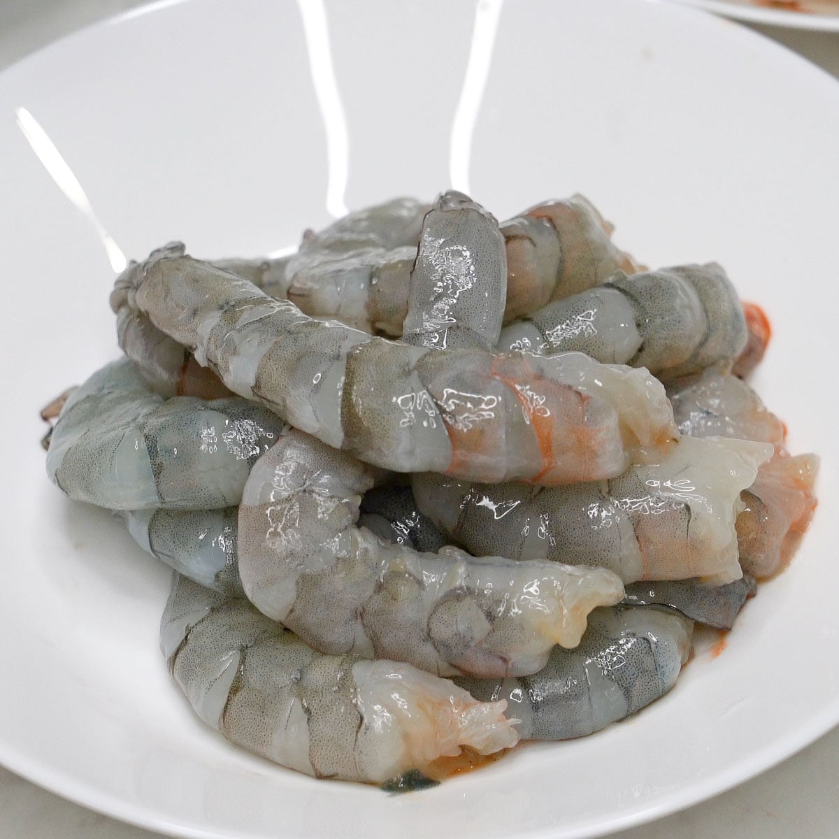Peeled and deveined shrimp in a bowl.