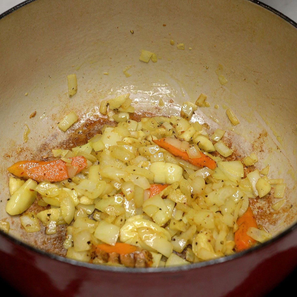 Sauteing aromatics in a pot.
