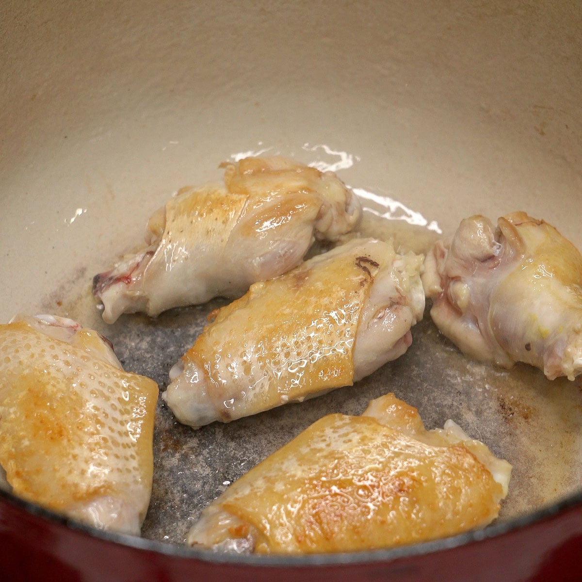 Browning chicken in the pot.