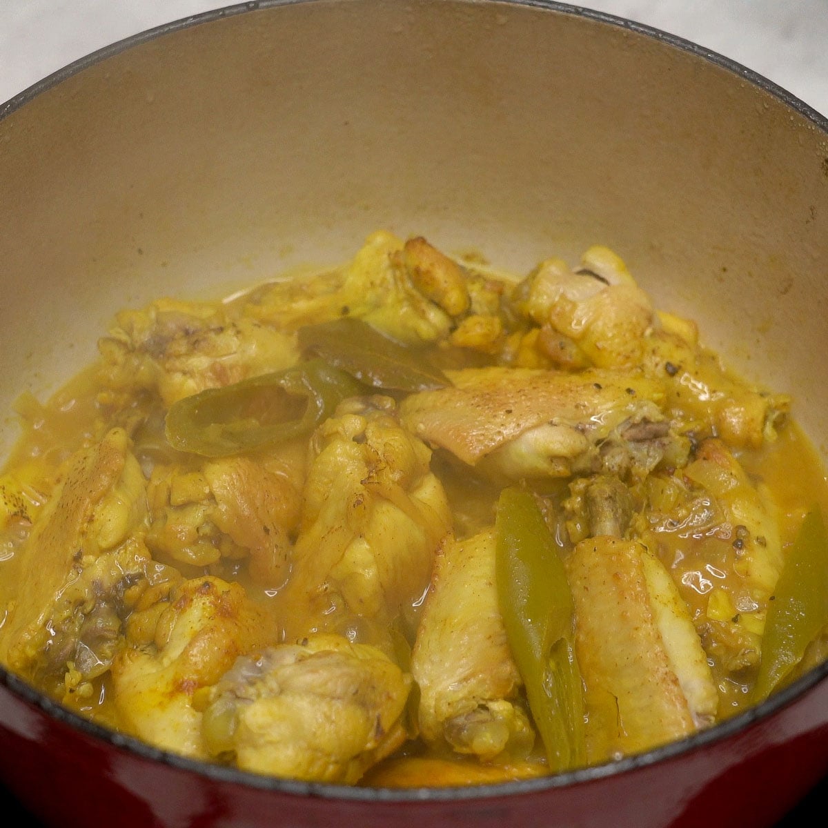 Adobong dilaw cooking in a pot.