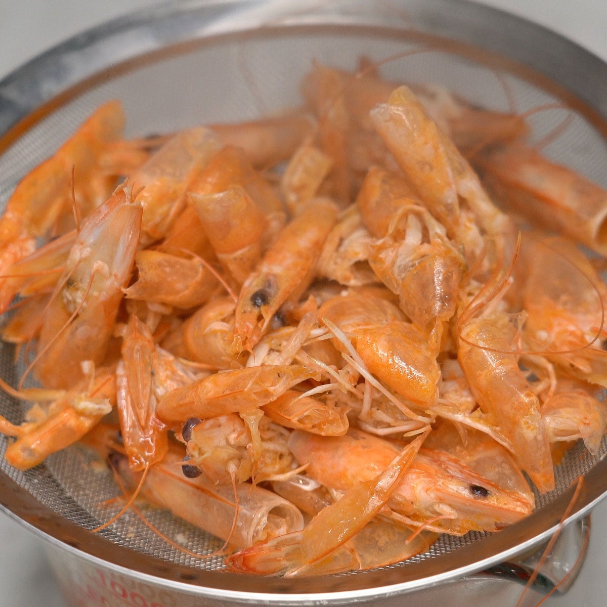 Straining the shrimp stock.