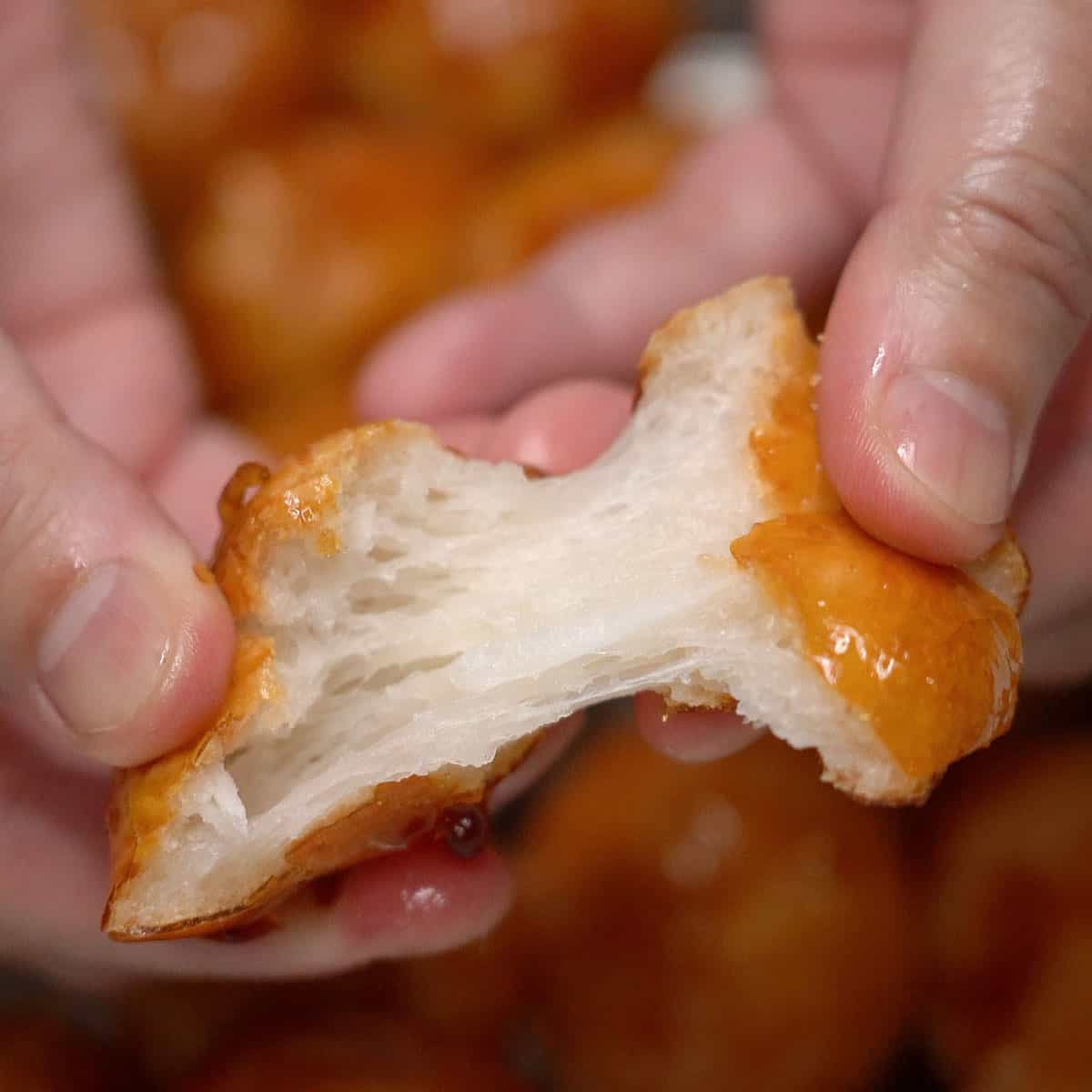 Breaking open a carioca ball to show the chewy center.