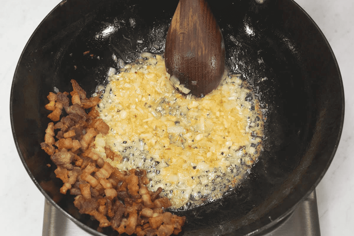 Sauteing the aromatics in the wok.