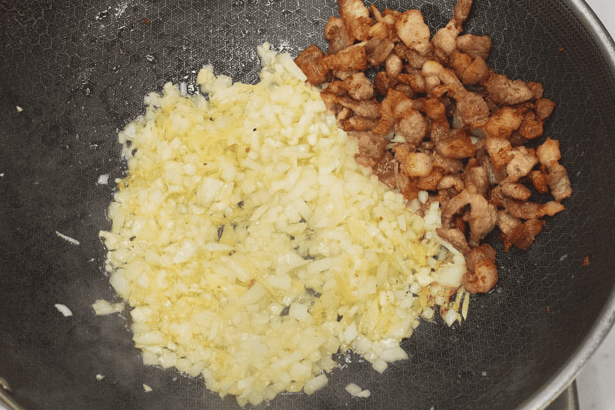 Sauteing the aromatics in the wok.
