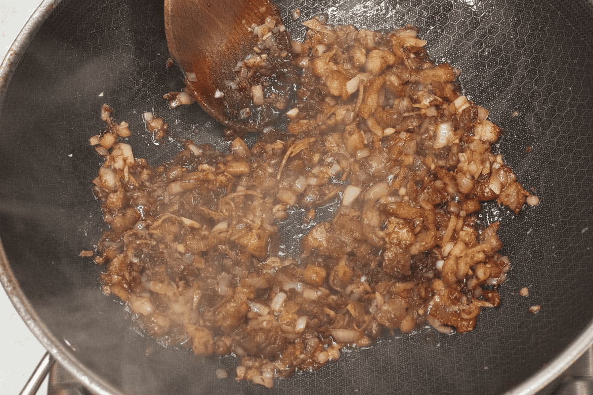 Sauteing the shrimp paste with the aromatics.