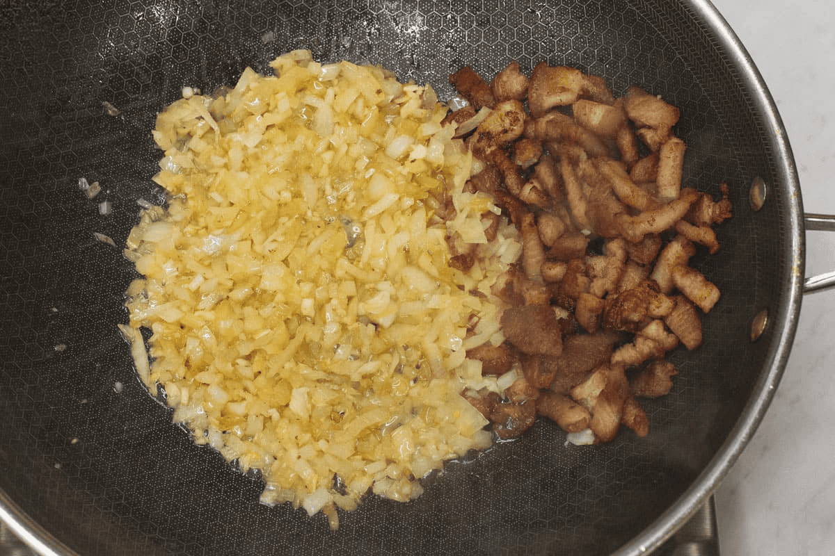 Sauteing the aromatics in the wok.