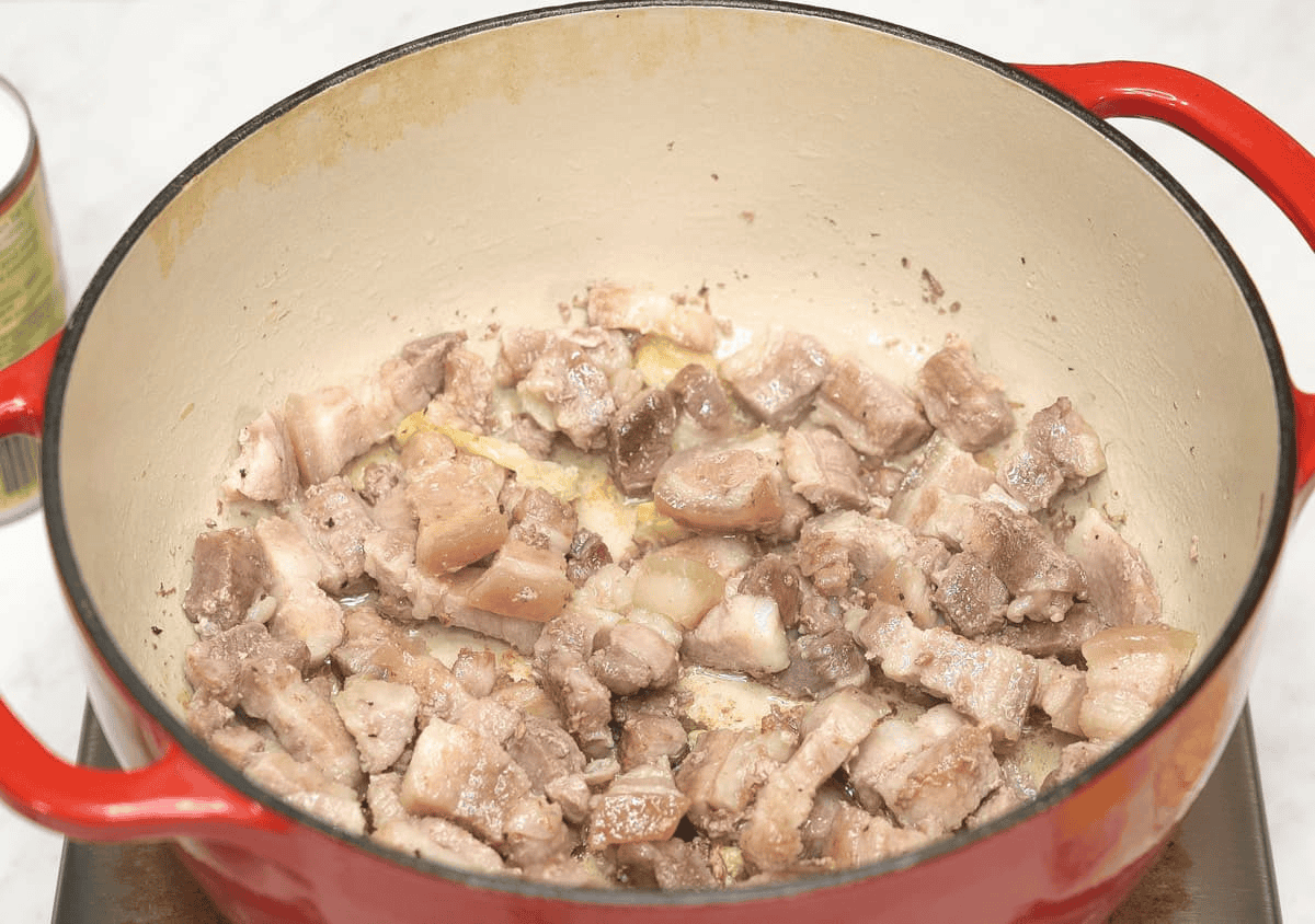 Boiled meat with aromatics in the pot.