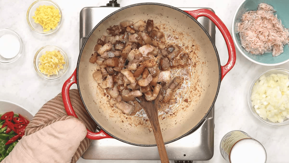 Lightly browned pork belly in the pot.