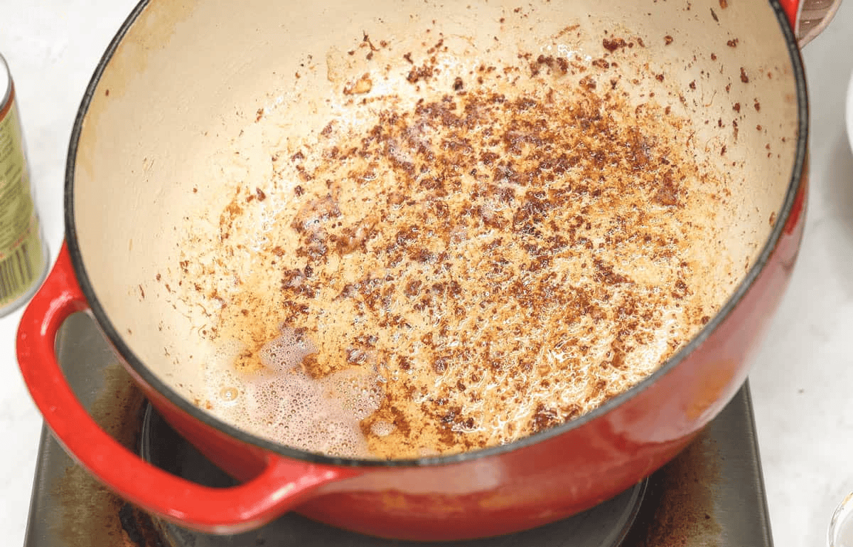 Excess pork fat in the pot.