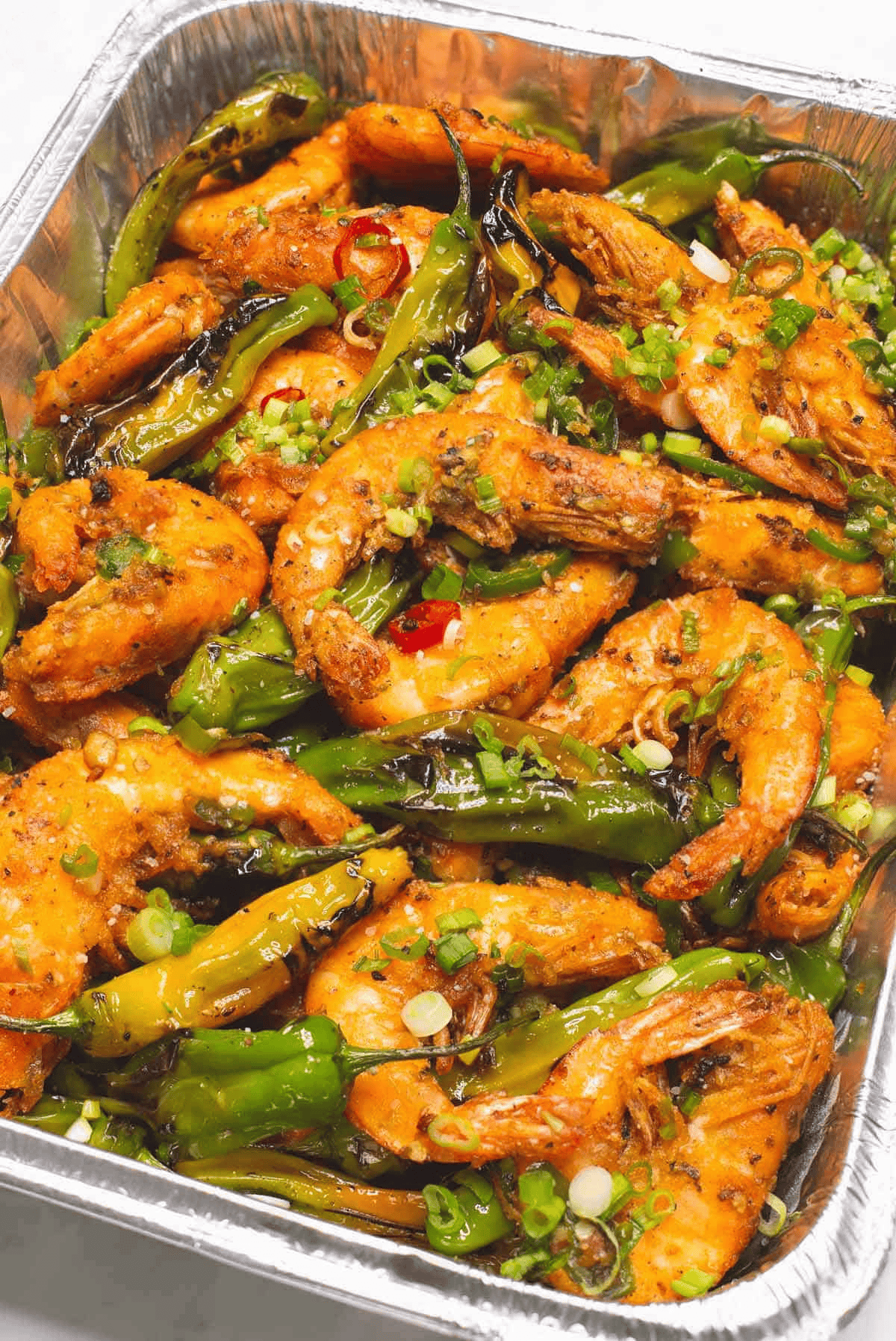 Big Batch Salt and Pepper Shrimp in an aluminum pan.