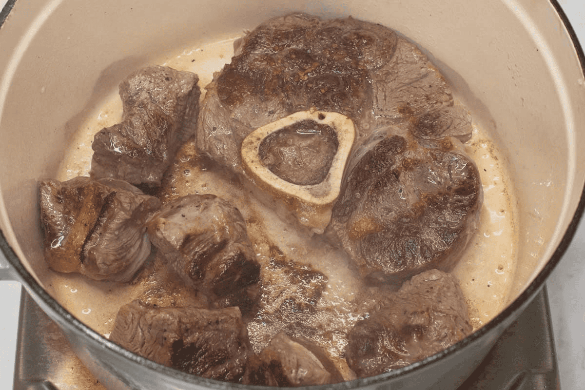 Searing the meat in the pot.