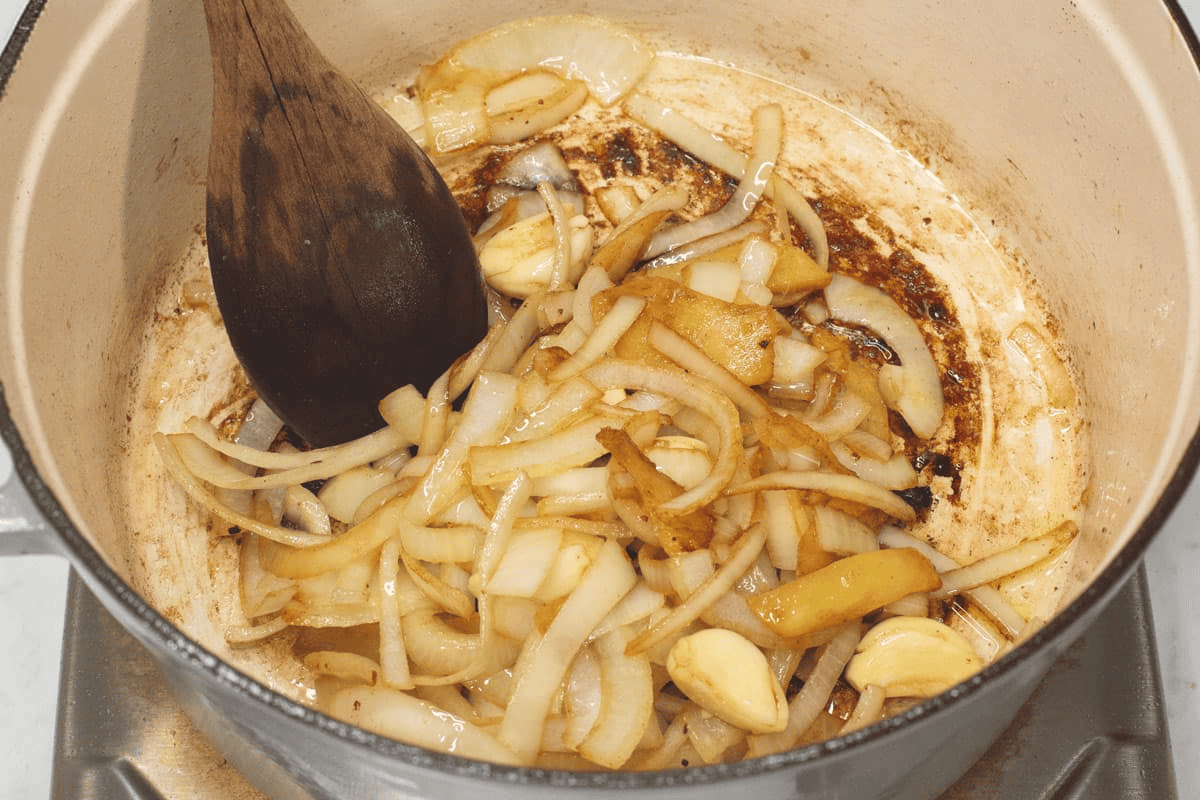 Sauteing the aromatics in the pot.
