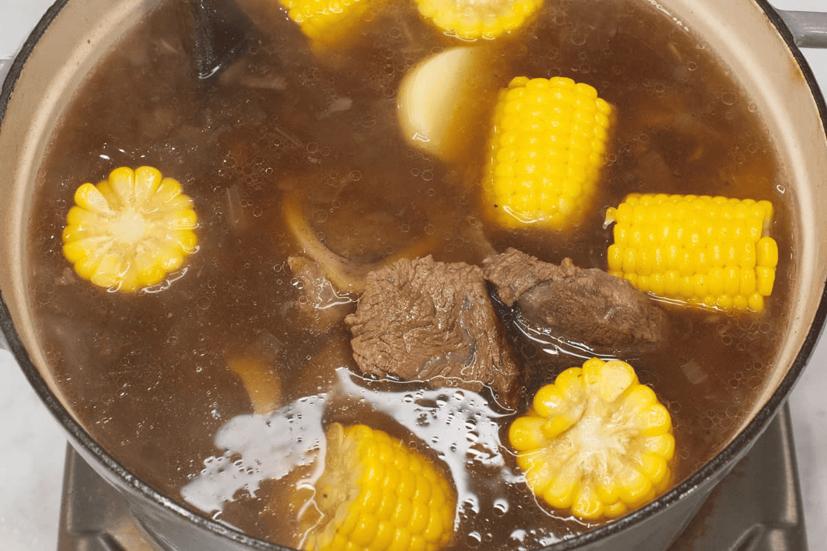Added the potatoes and corn to the pot.