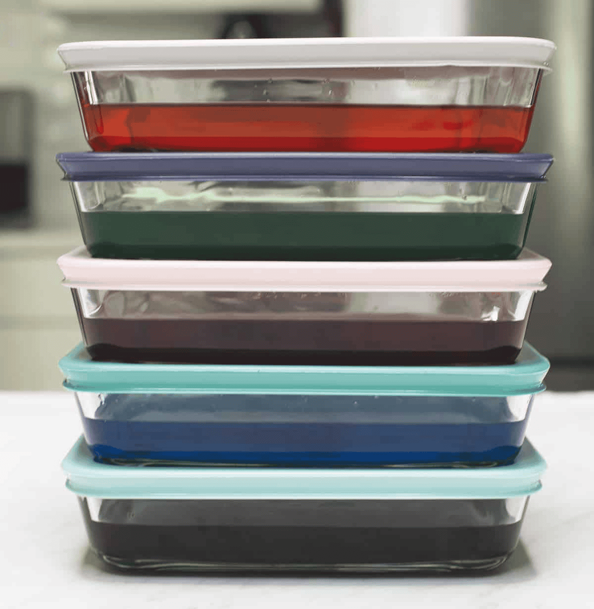 Stacked up containers of assorted gelatin.