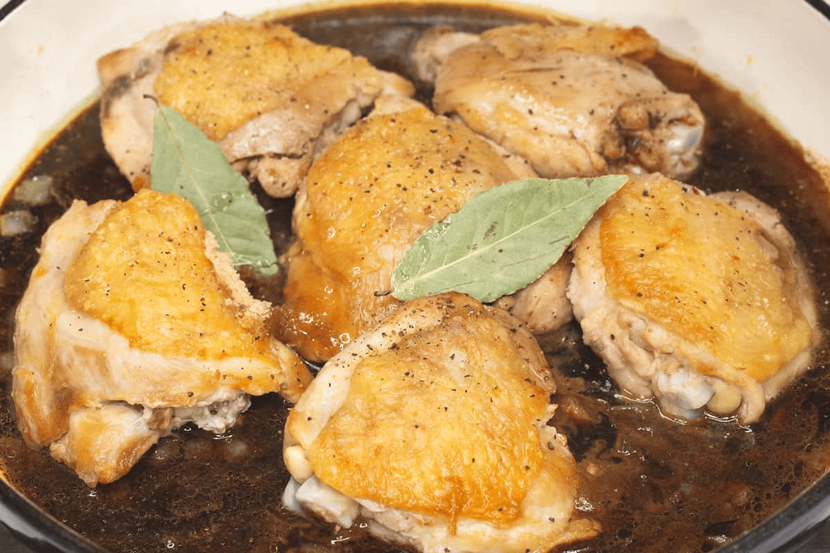Chicken and other ingredients in the saute pan.