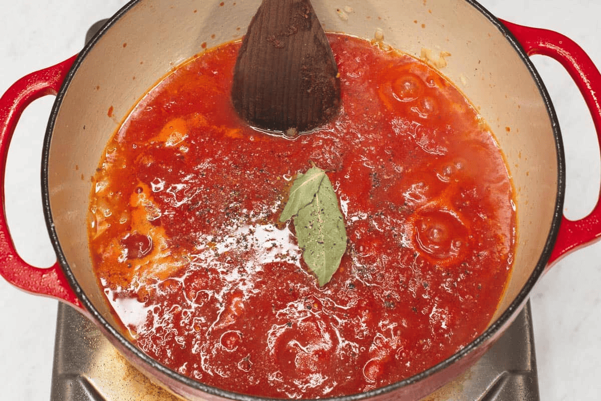 Mixing the sauce in the pot.