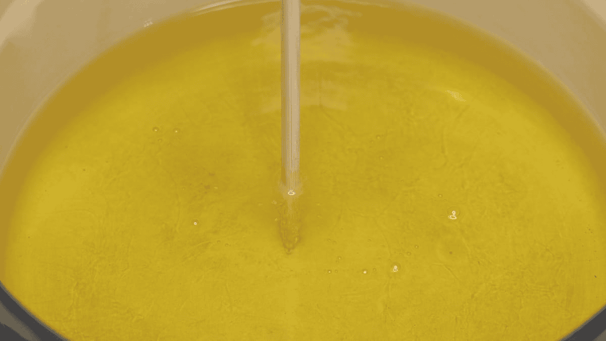 checking if the oil is hot with a chopstick
