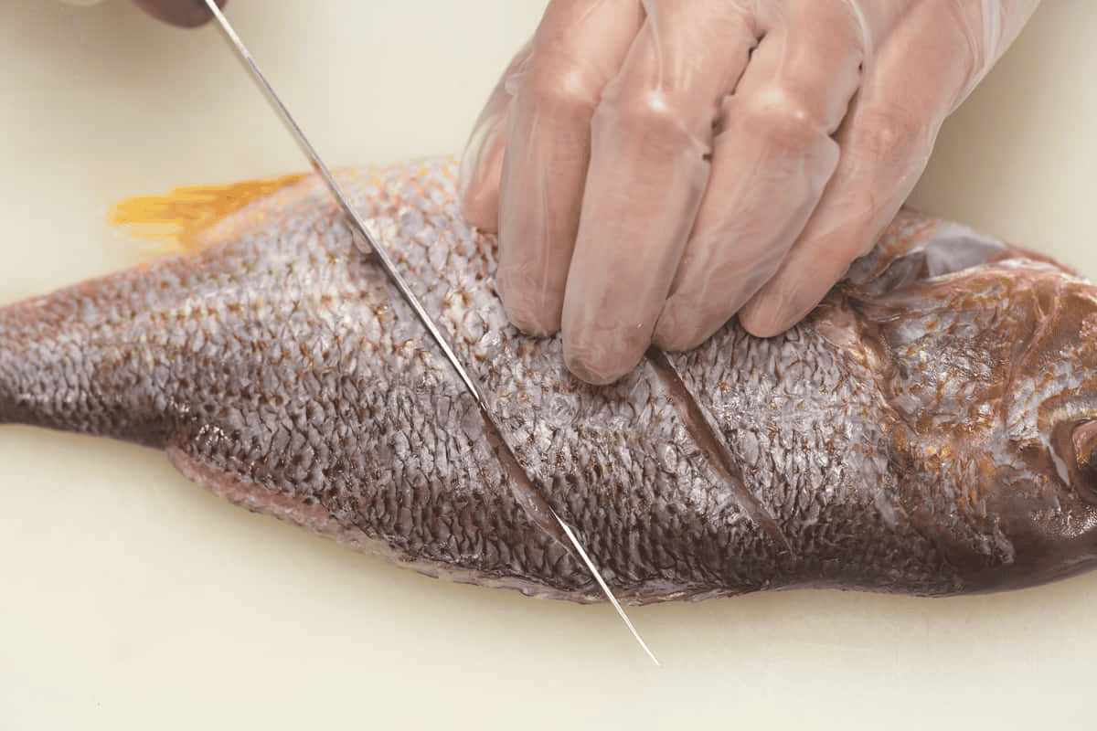 Scoring the fish.