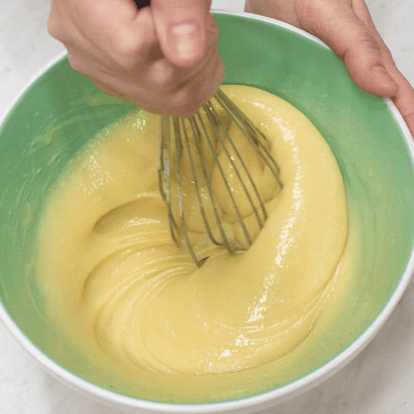 Whisking the wet ingredients in a bowl.