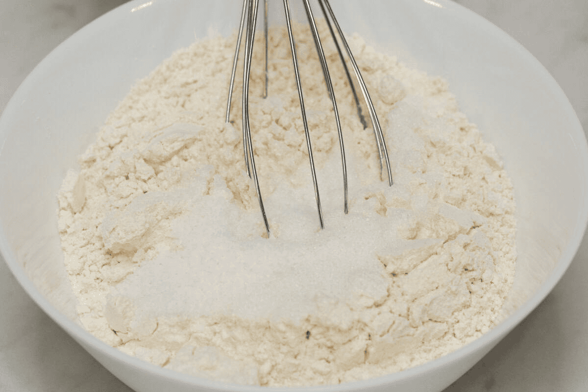 Whisking the dry ingredients in a bowl.