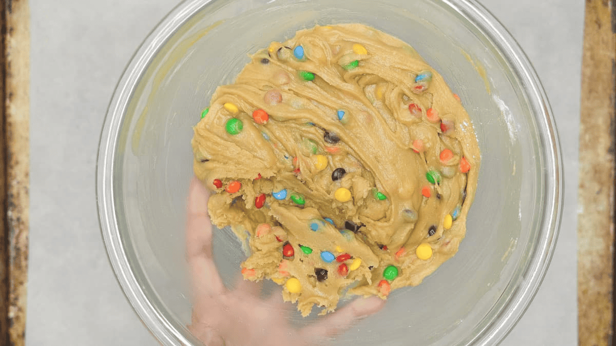 Chilled M&M cookie dough in a bowl.