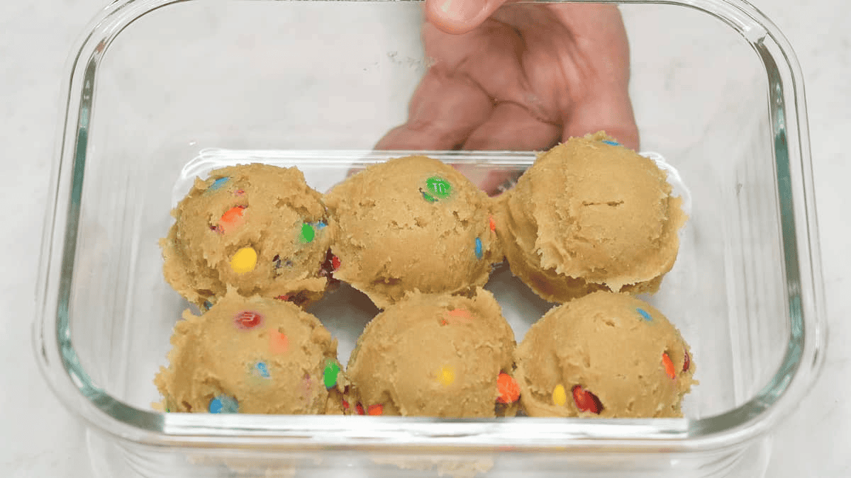 Portioned cookie dough on a glass container
