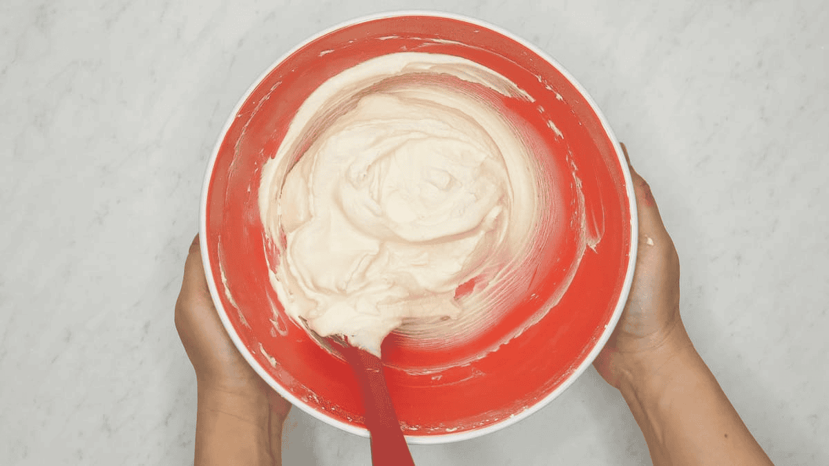 Cream cheese frosting in the bowl.