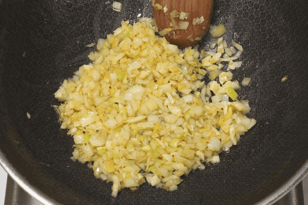 Sauteing the aromatics in the wok.