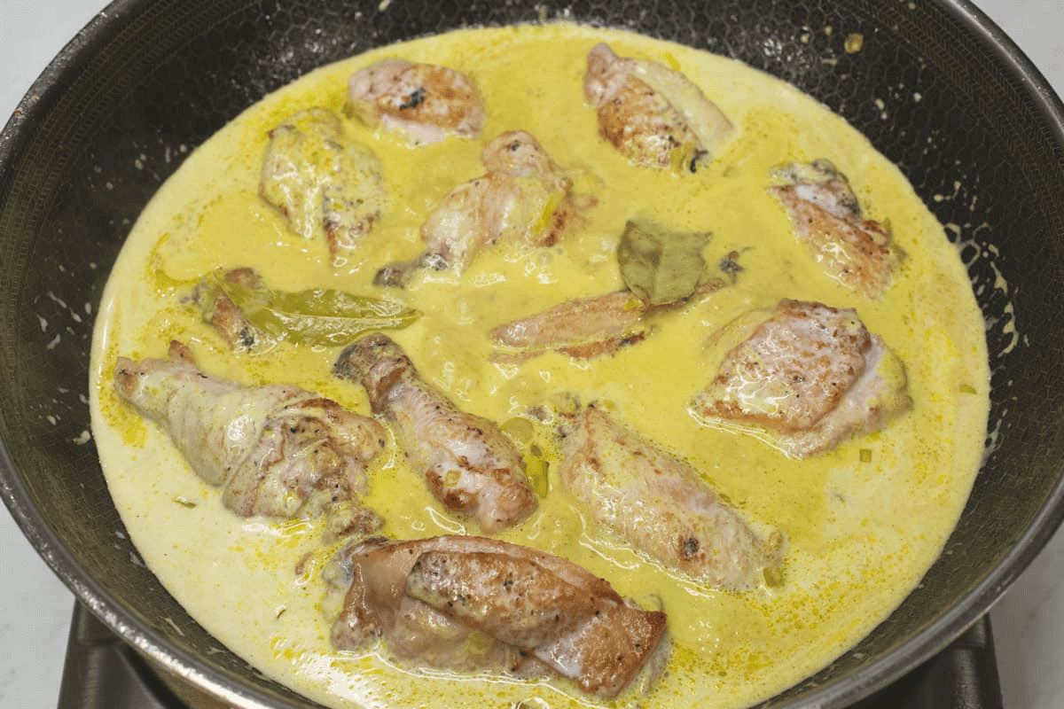 Simmering the mixture in the wok.
