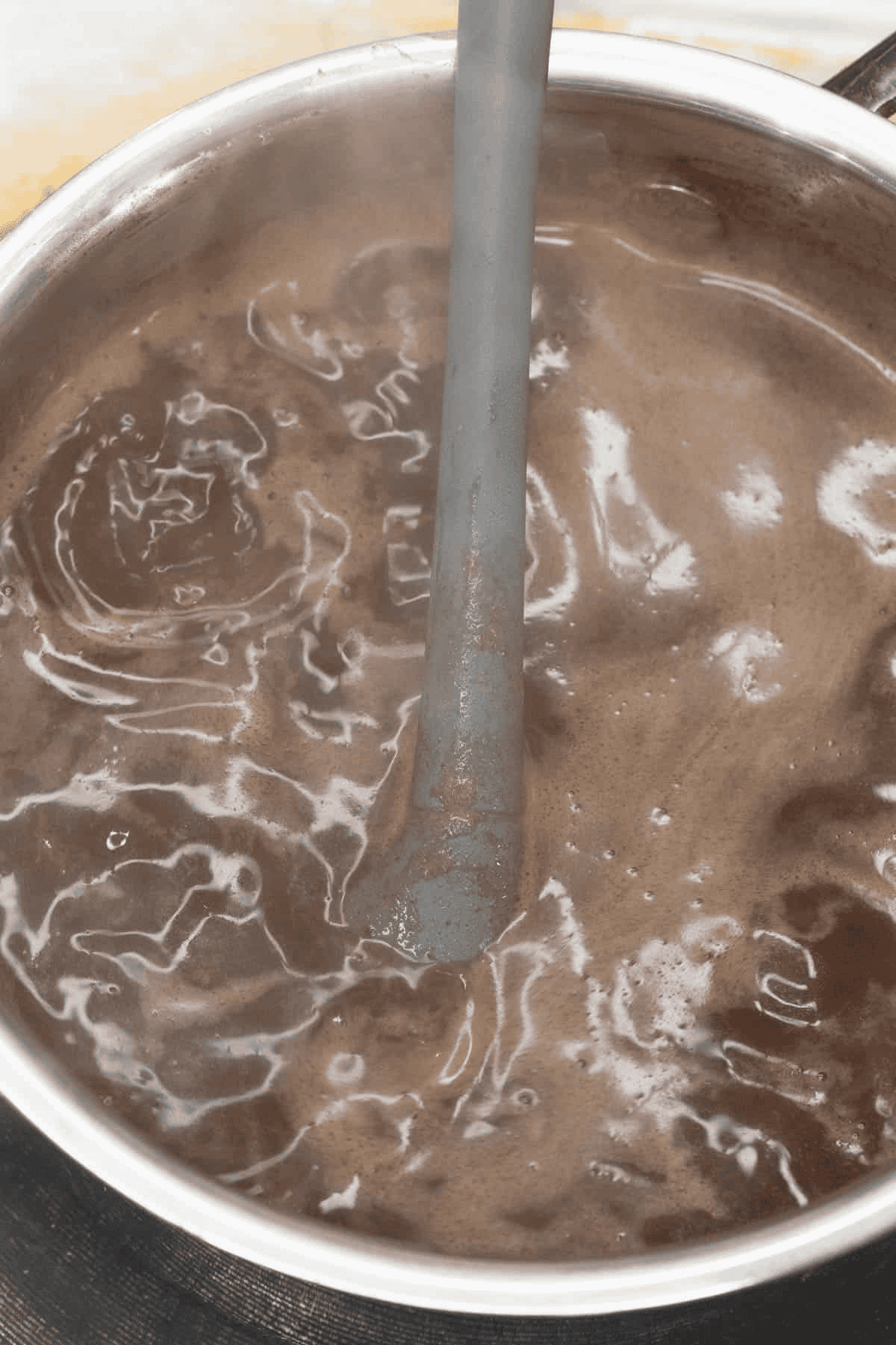 Mixing the hot chocolate in a saucepan.