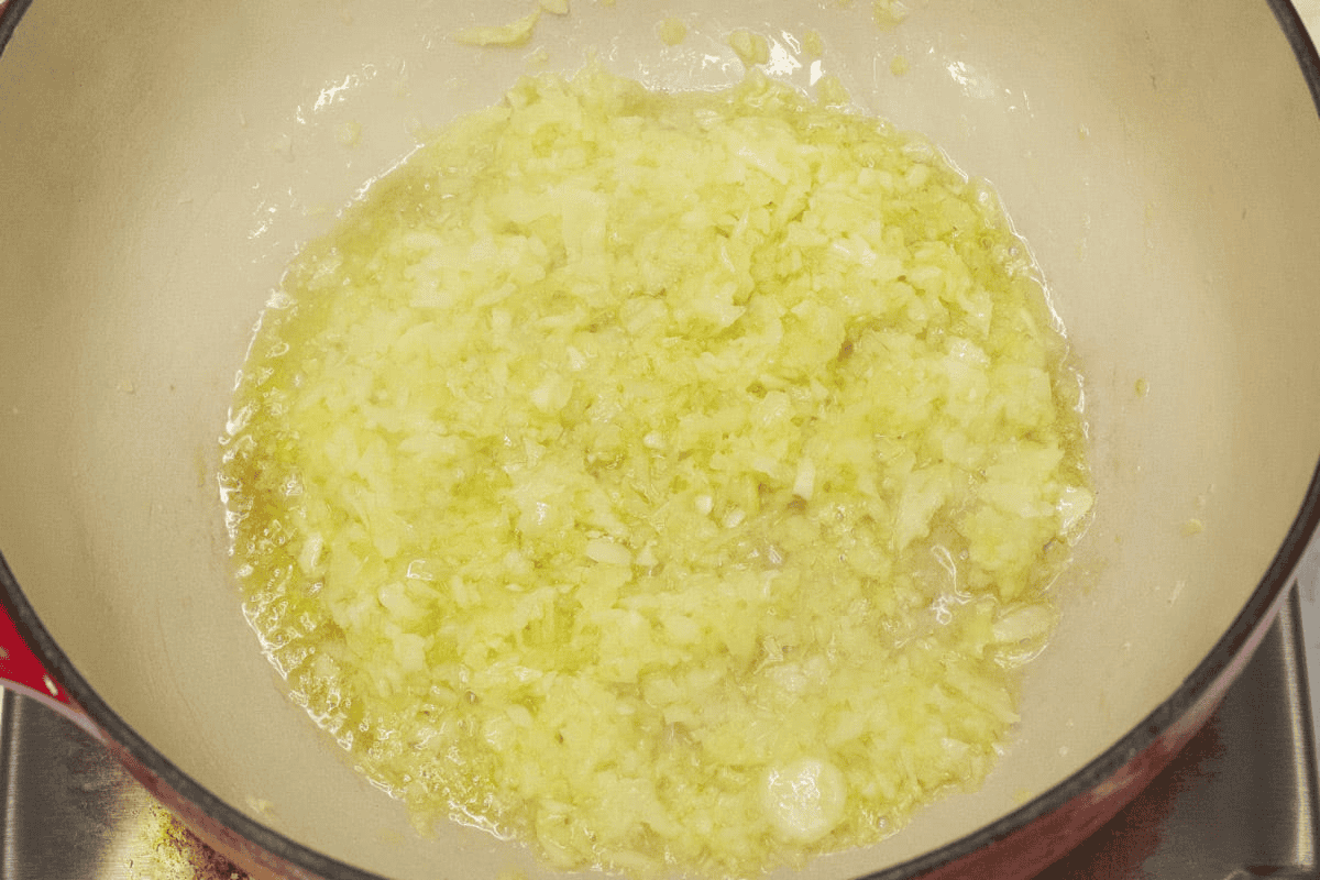 Sauteing the aromatics in the pot.