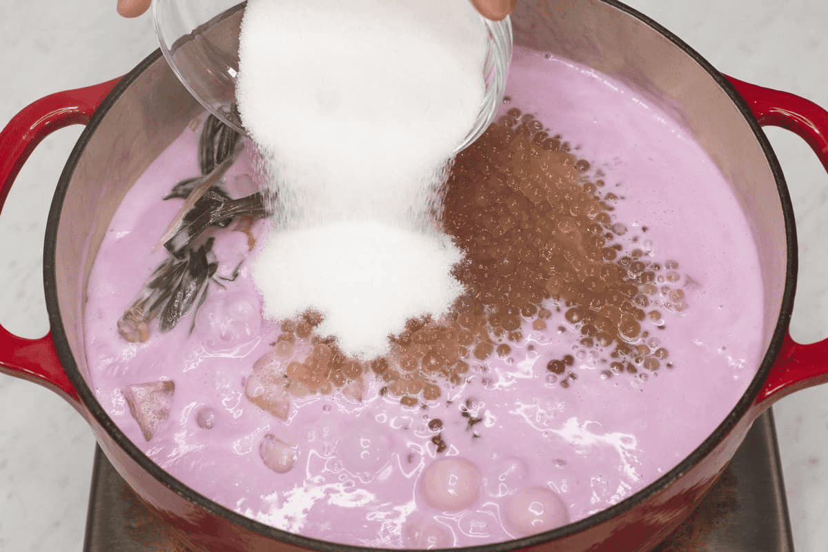 Adding the sago and sugar into the mixture.