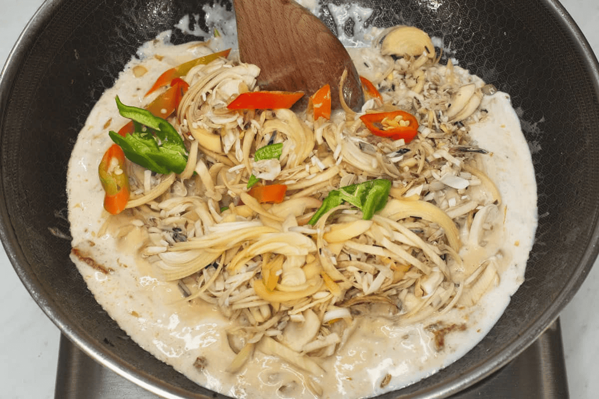 Added the banana blossoms and chilies to the coconut mixture.