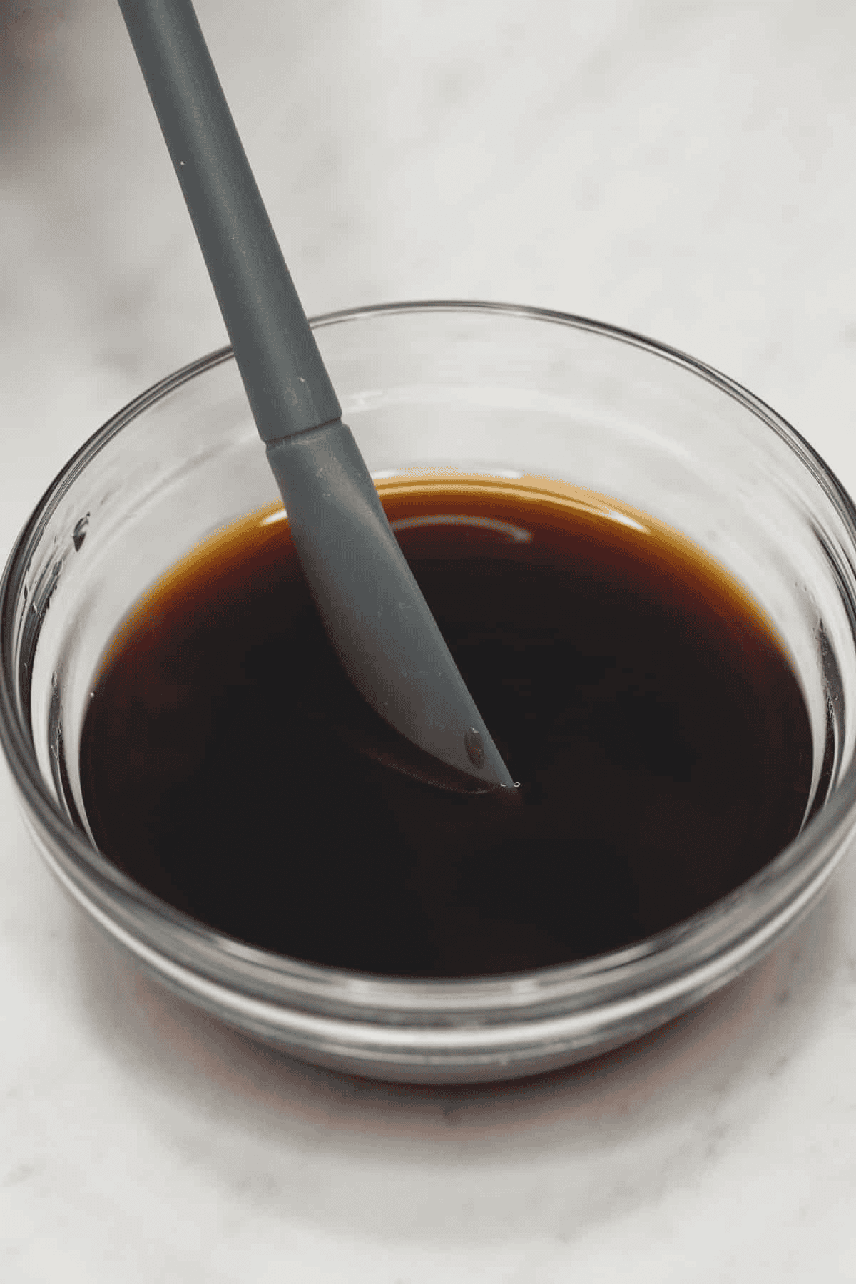 Mixing the sauce in a bowl.
