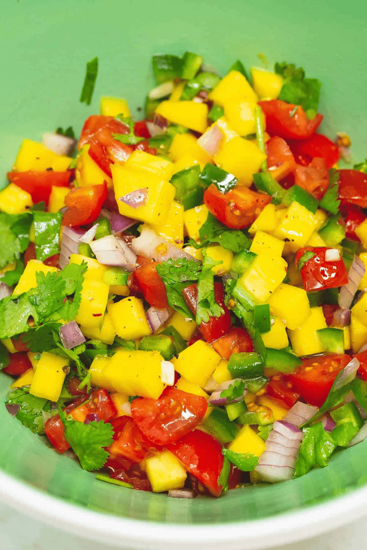 Tomato-mango salsa in a bowl.