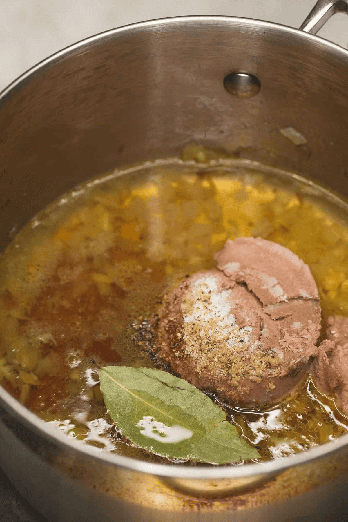 Combining lechon sauce ingredients in the saucepan.