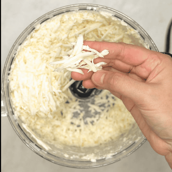 Shredded cassava in a food processor.