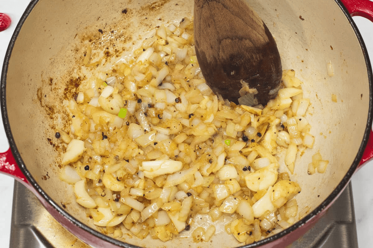 Sauteing the aromatics in the pot.
