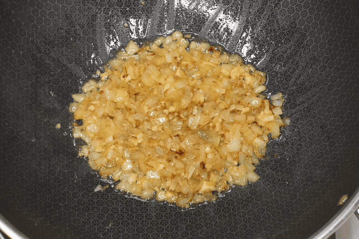 Sauteing the aromatics in the wok.