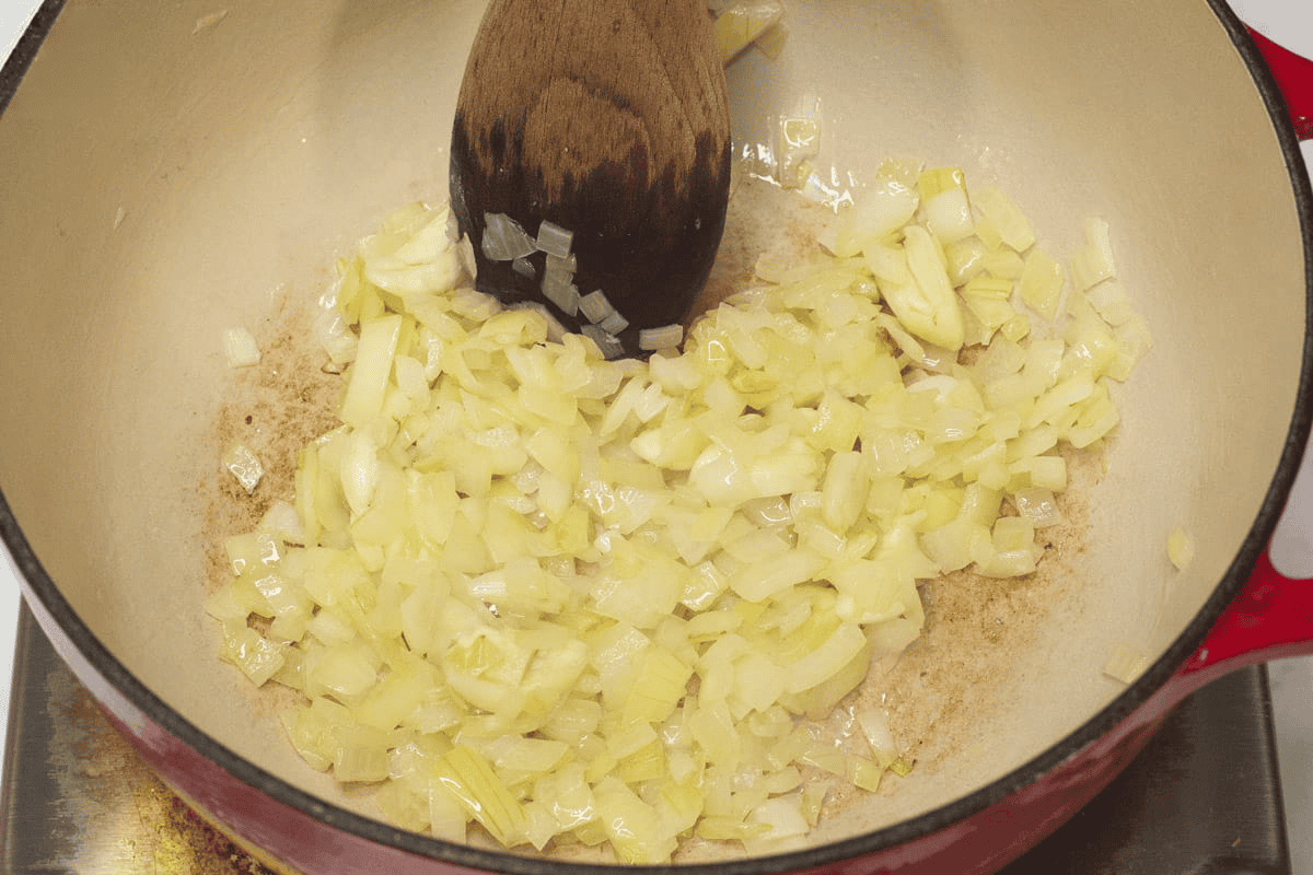 Sauteing the aromatics in the pot.