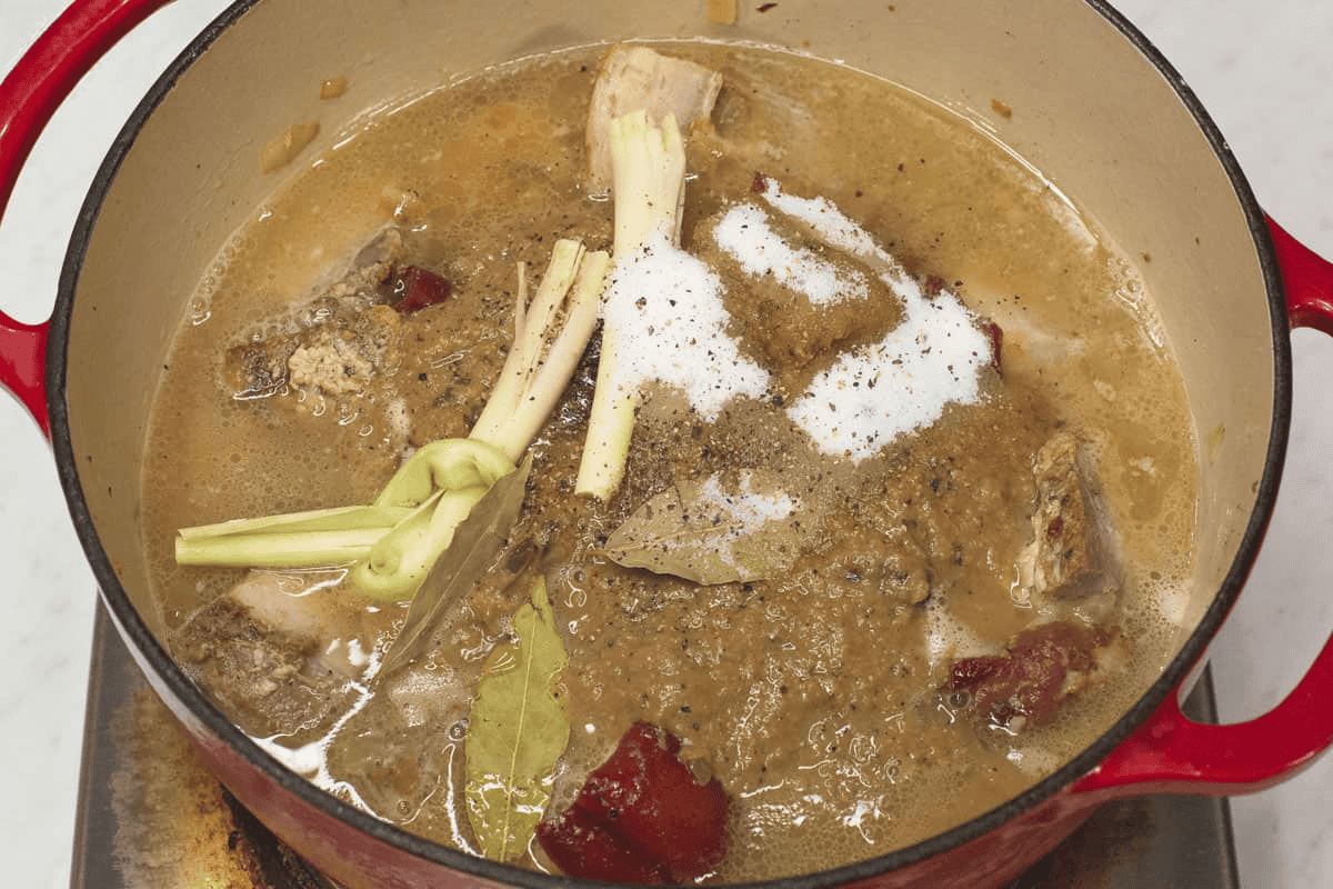Combining the ingredients in the pot.