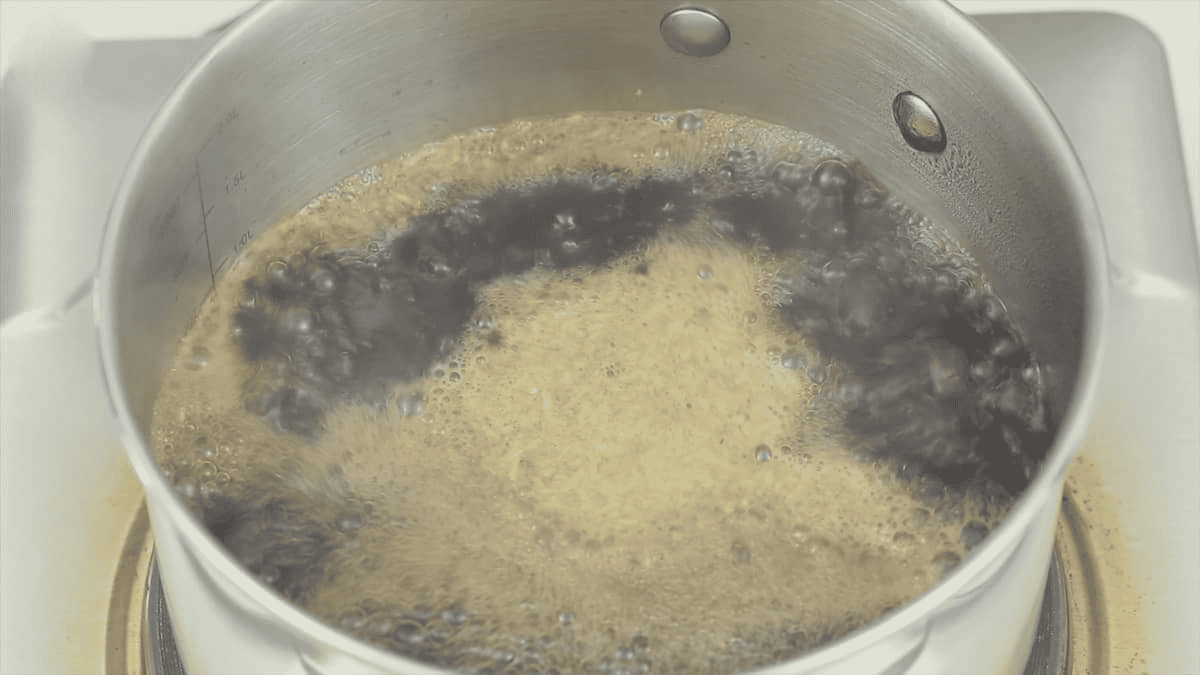 Boiling the sauce for Lumpiang Sariwa (Fresh Spring Rolls).