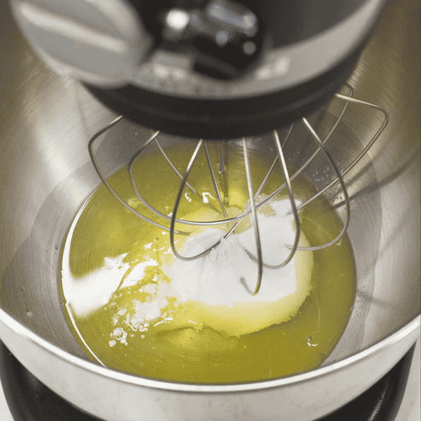 Egg whites, sugar, and cream of tartar in a mixer bowl.