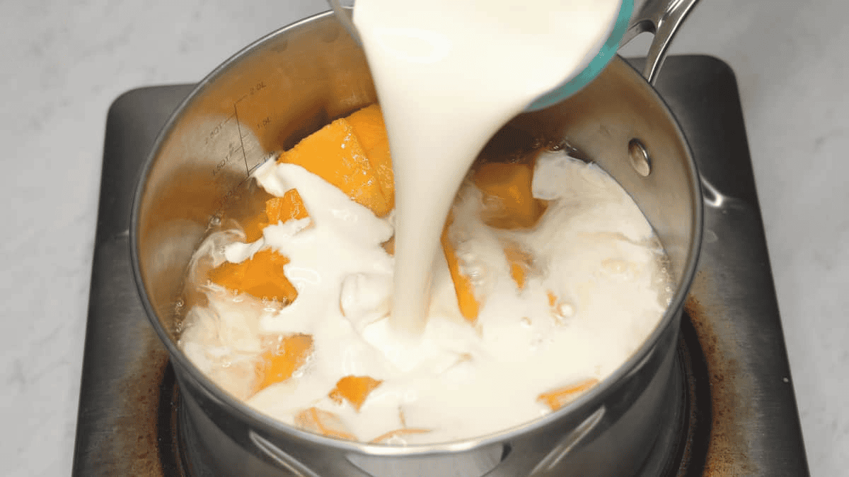 Combining the ingredients in the saucepan.