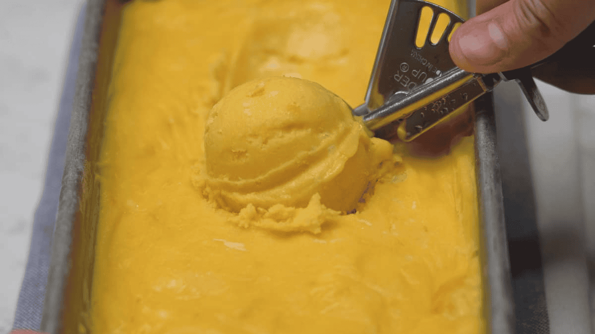 Scooping the ice cream in the loaf pan.