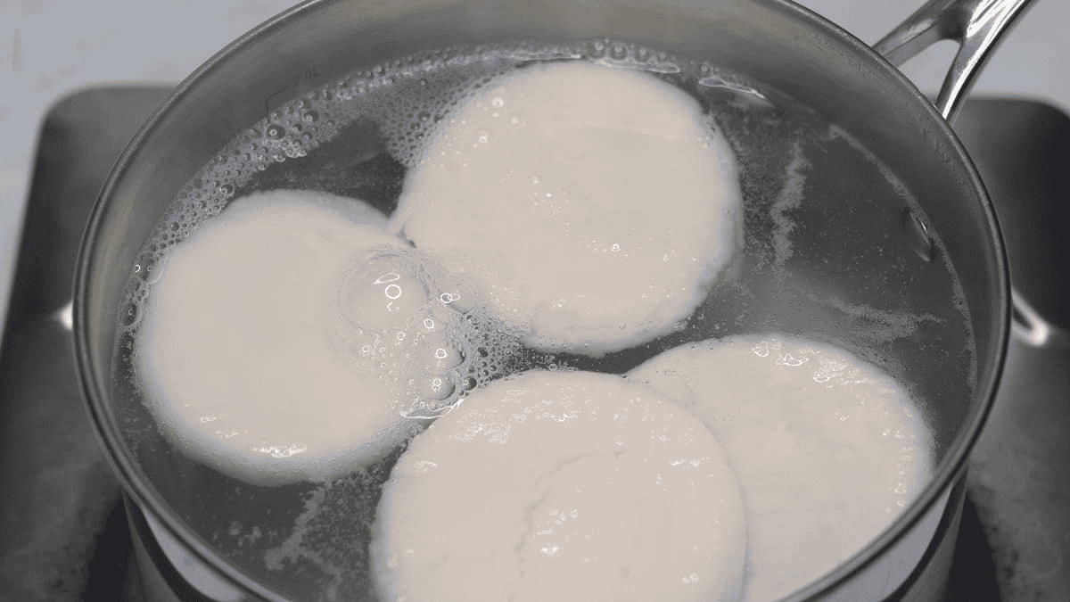 Palitaw (Sweet Rice Cakes) floating in water.