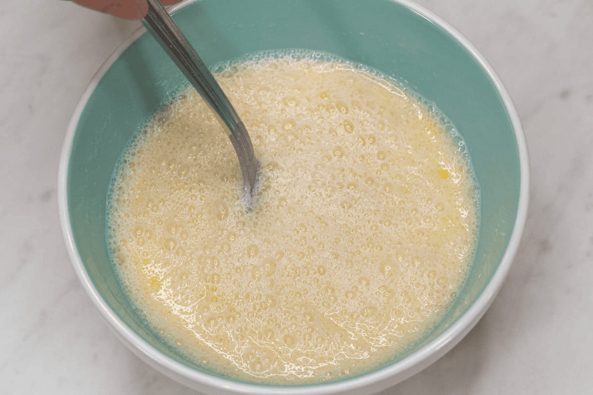 Mixing the wet ingredients in the bowl.