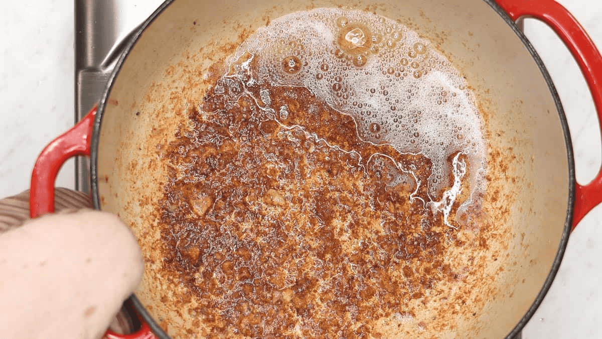 Excess pork fat in the pot.
