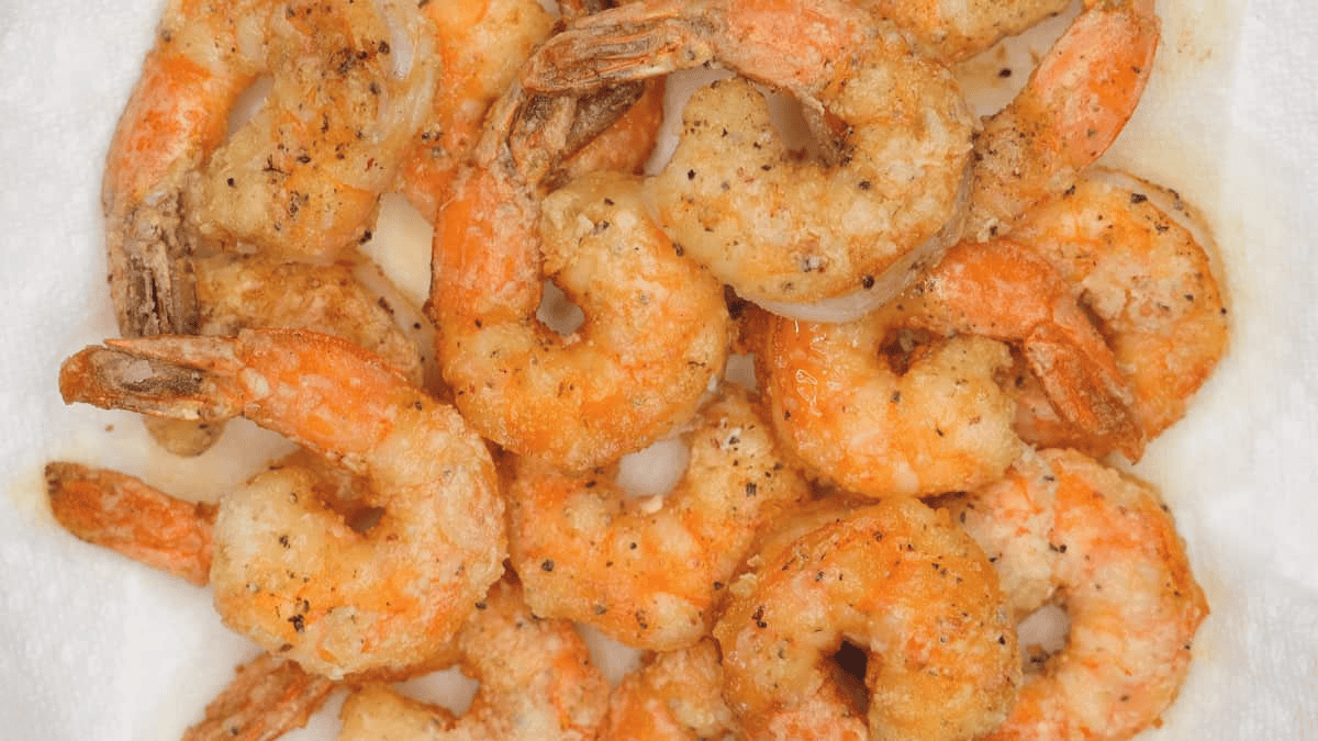 Fried shrimp on paper towels.
