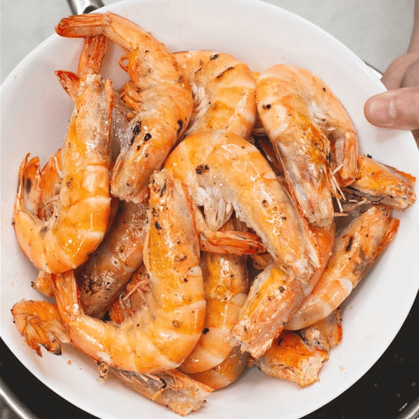 Seared shrimp on a plate.